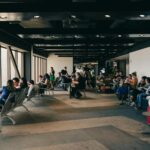 Passengers relaxing in a São Paulo airport waiting area, capturing a travel moment.